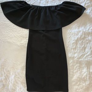 Off the shoulder black mini dress.